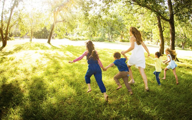 family running through field